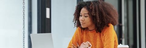 Young girl doing research on computer