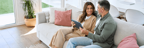 Couple on tablet researching hvac systems