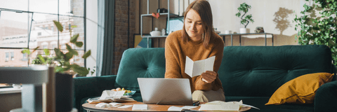 Woman doing taxes at home