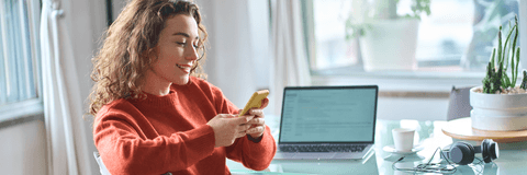 Young woman checking mobile banking on phone