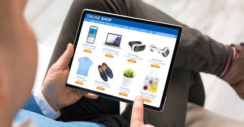 Man online shopping on tablet at home