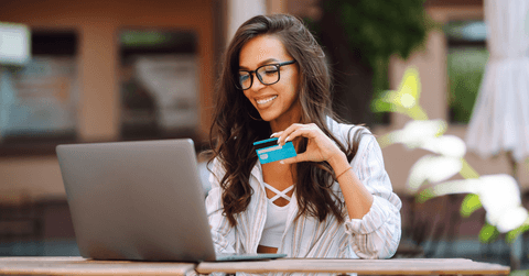 Young woman paying for an online shopping order
