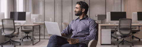 Young man thinking about his banking options with laptop