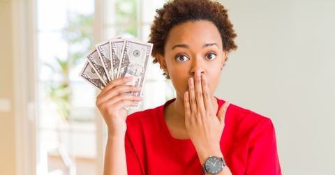 Woman holding cash