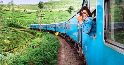 Woman leaning out of train window