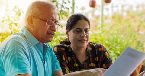 Senior couple reviewing bills