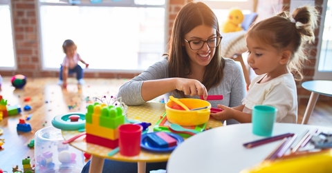 daycare teacher with child