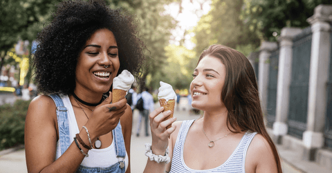 Happy women eating ice cream 