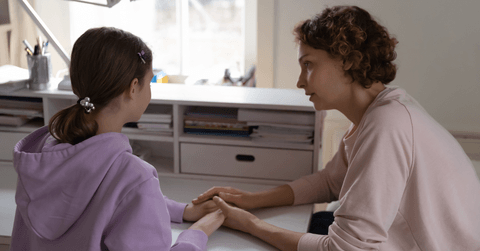Mom talking to daughter