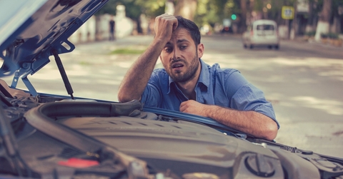 stressed man having trouble with broken car