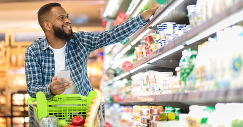 black male shopping groceries in supermarket