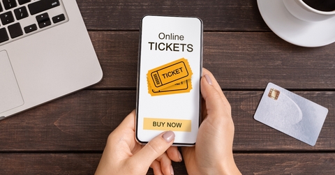 Someone buying tickets on their phone