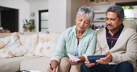 elderly couple working out a budget