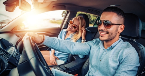 Happy couple driving