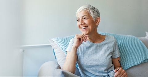 mature woman relaxing on her couch at home in the sitting room