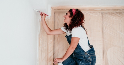 woman painting home improvement