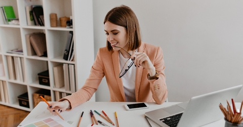 lady with smile looks at documents 