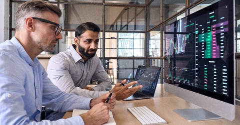 stock exchange market investors discussing trading charts