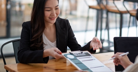 employer reviewing good cv of prepared skilled applicant 
