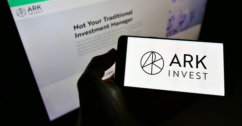 Ark Invest on the phone screen and background computer screen