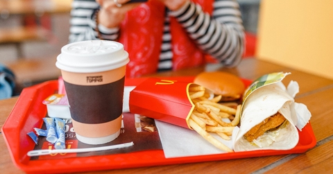 hamburger drink and fries on a tray in McDonald fast food restaurant