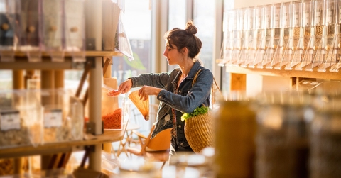  young woman shopping in a bulk food store