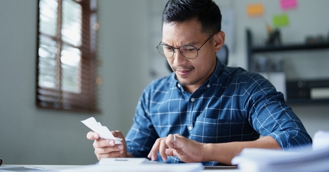 male SME business owner with a stressed and anxious face 
