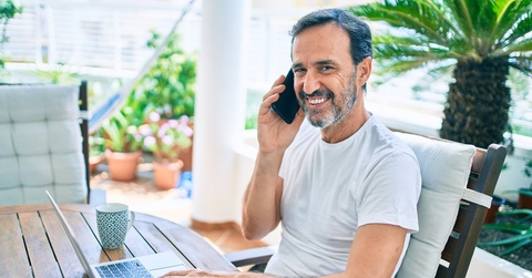 middle age man with beard smiling happy at the terrace 
