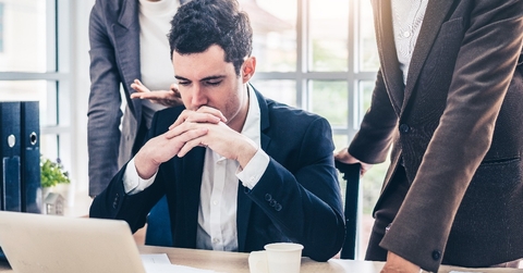 businessman worry about his job with serious boss