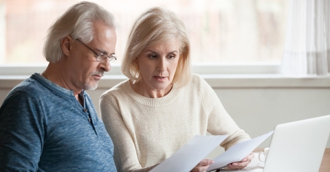 old couple reading documents