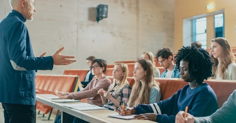 professor holding lecture to a multi ethnic group of students