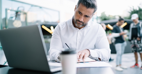 businessman using laptop computer for informative research