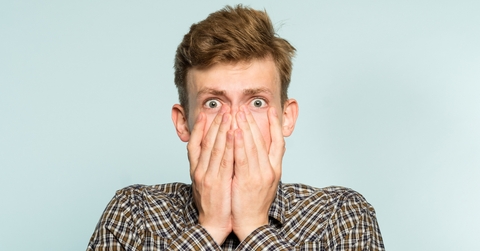 dumbfounded young guy on light background