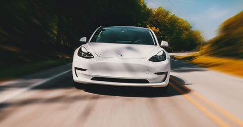 White tesla fast on the road