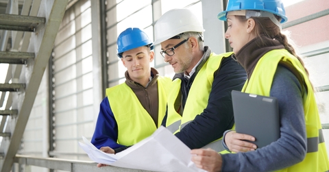 construction site manager with young people in training period