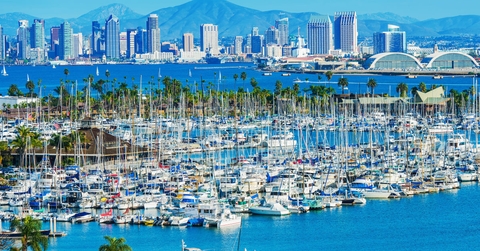 panoramic shot of san diego beach with lots of boats during day time
