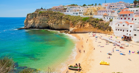 beautiful houses in line at strand algarve beach in portugal
