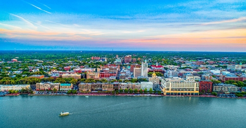 aerial shot of savannah with skylines and homes