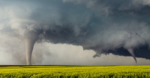 tornado in between green field
