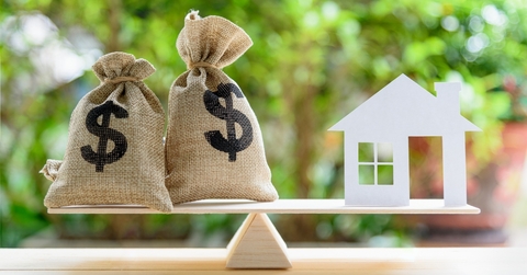 house paper model US dollar hessian bags on a wood balance scale