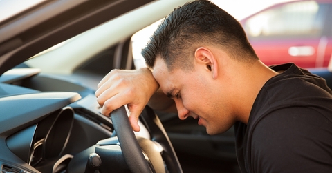 stressed young man in a car
