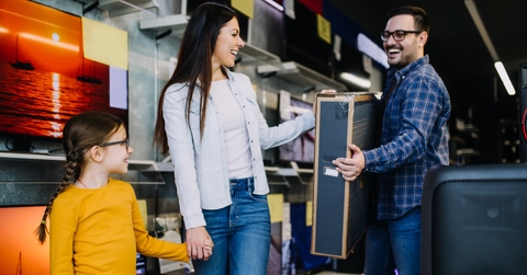 happy family buying TV in store