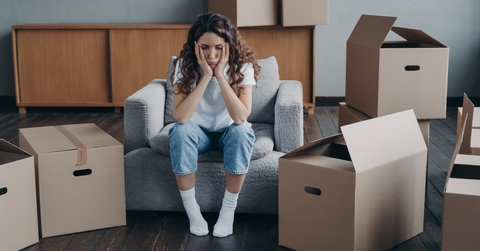 unhappy woman is sad because of relocation