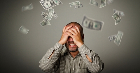 frustrated man and falling dollars