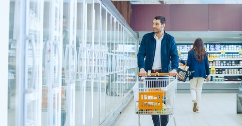Man pushes shopping cart