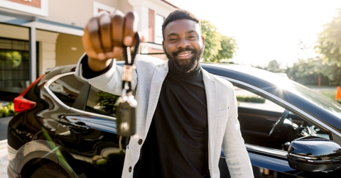 car seller holding car keys