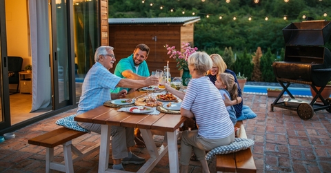 family celebrating holiday together in the backyard