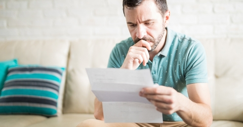 Latin man reading correspondence