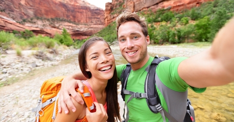 travel hiking selfie by happy couple on hike