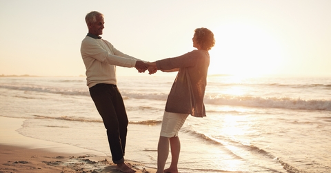 mature couple enjoying themselves on the beach